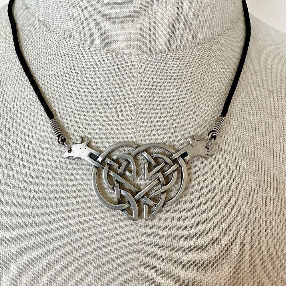 Silver tone double dog knotted pendant necklace